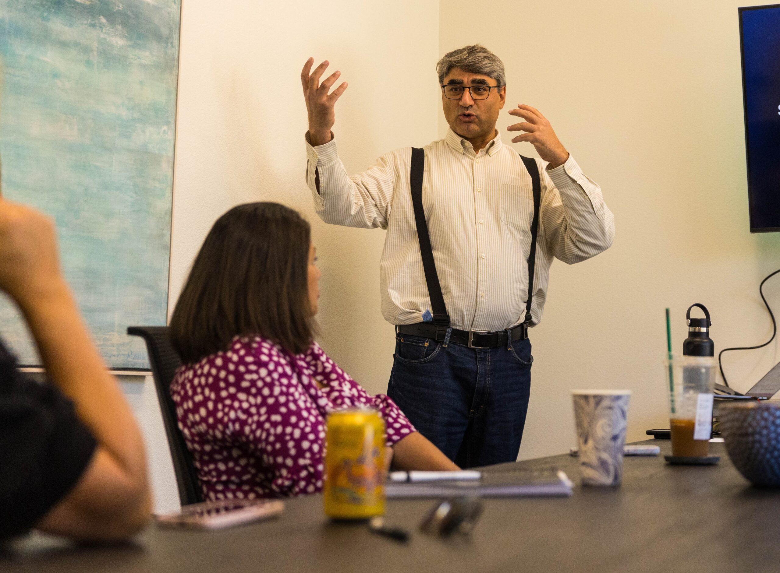 Finance Professor Hamed Ghoddusi addresses students in a class