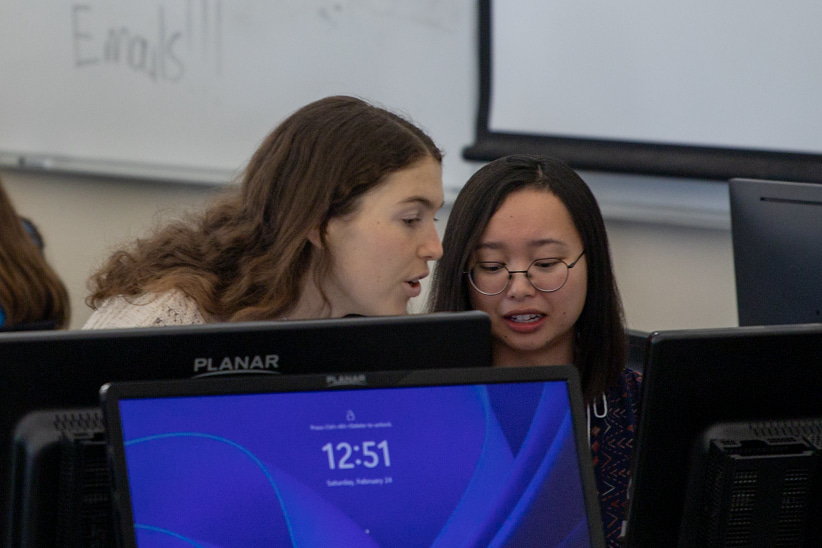 Students work at a volunteer tax clinic