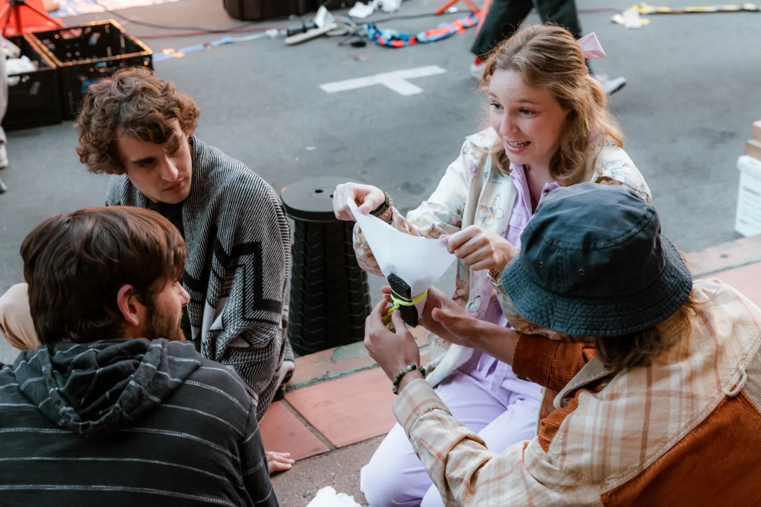 Participants in the egg drop contest create packages