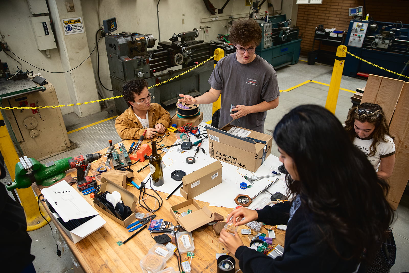 An overhead shots of students collaborating on a project in a lab