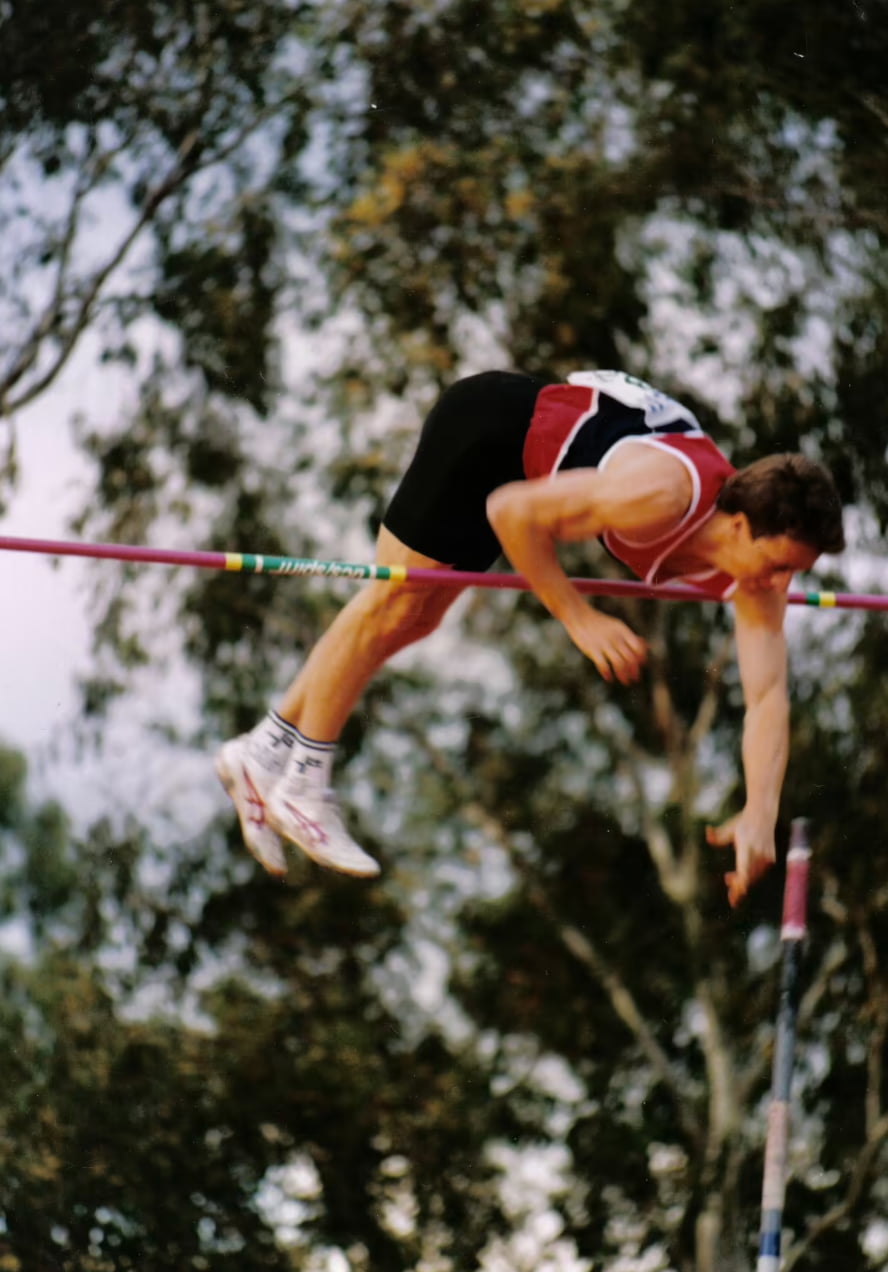 A pole vaulter Simon Arkell clears the bar