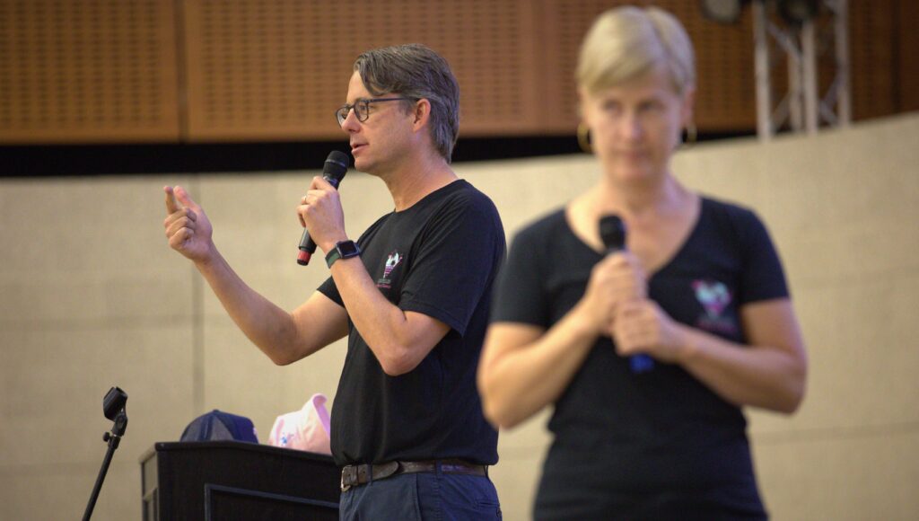Two members of On Your Feet, a Portland-based collective, addressing new Orfalea students.