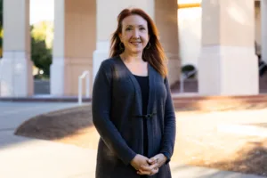 Shannon Fast poses for a portrait outside Cal Poly's business building.