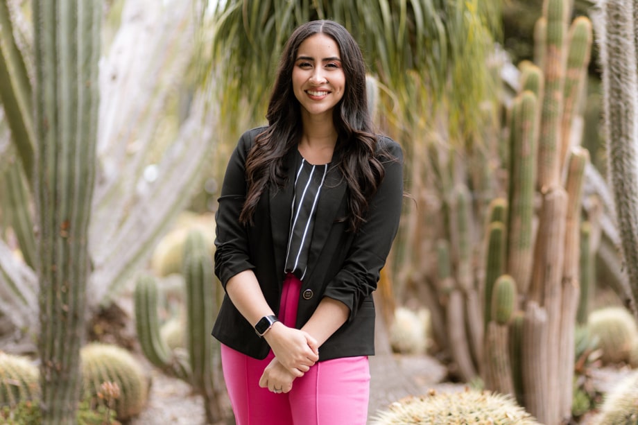 Yesenia Beas posing in a cactus garden