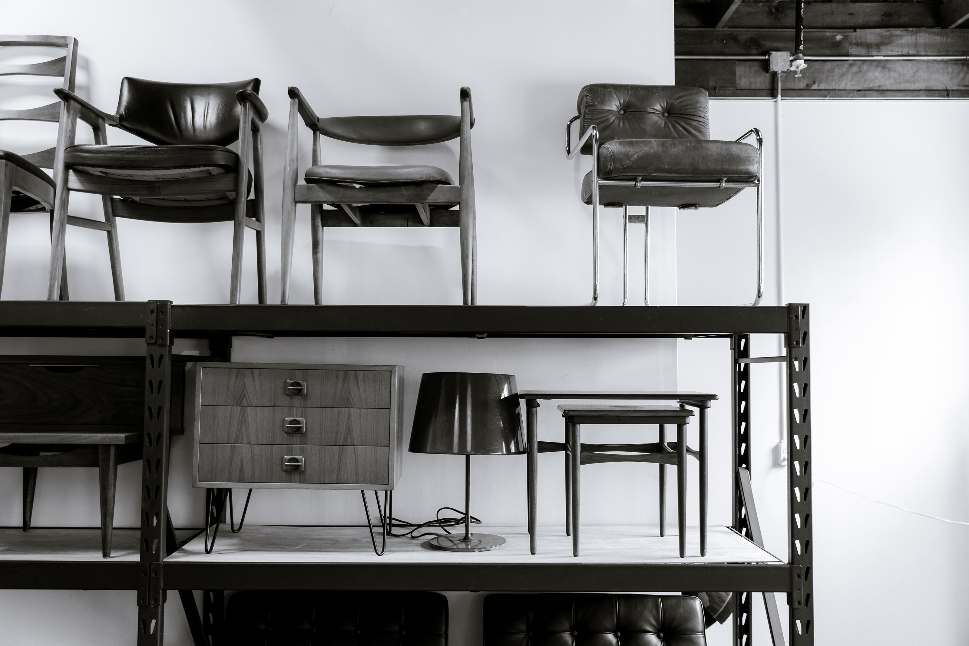 Furniture stacked on metal shelving