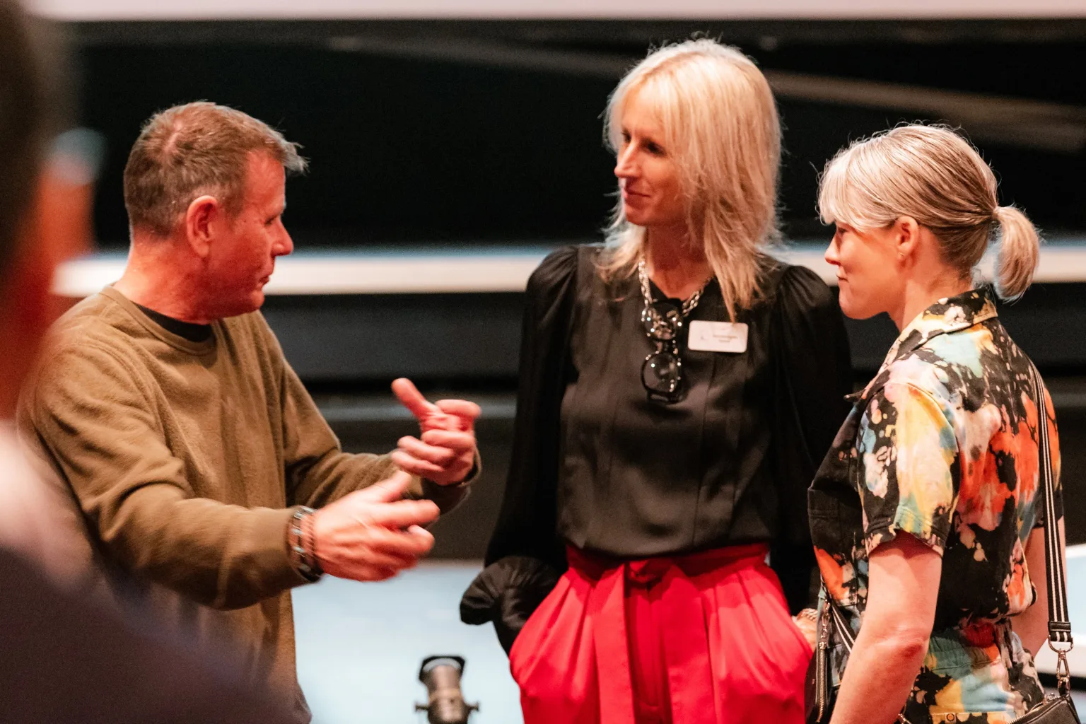 Three people speak after a keynote address