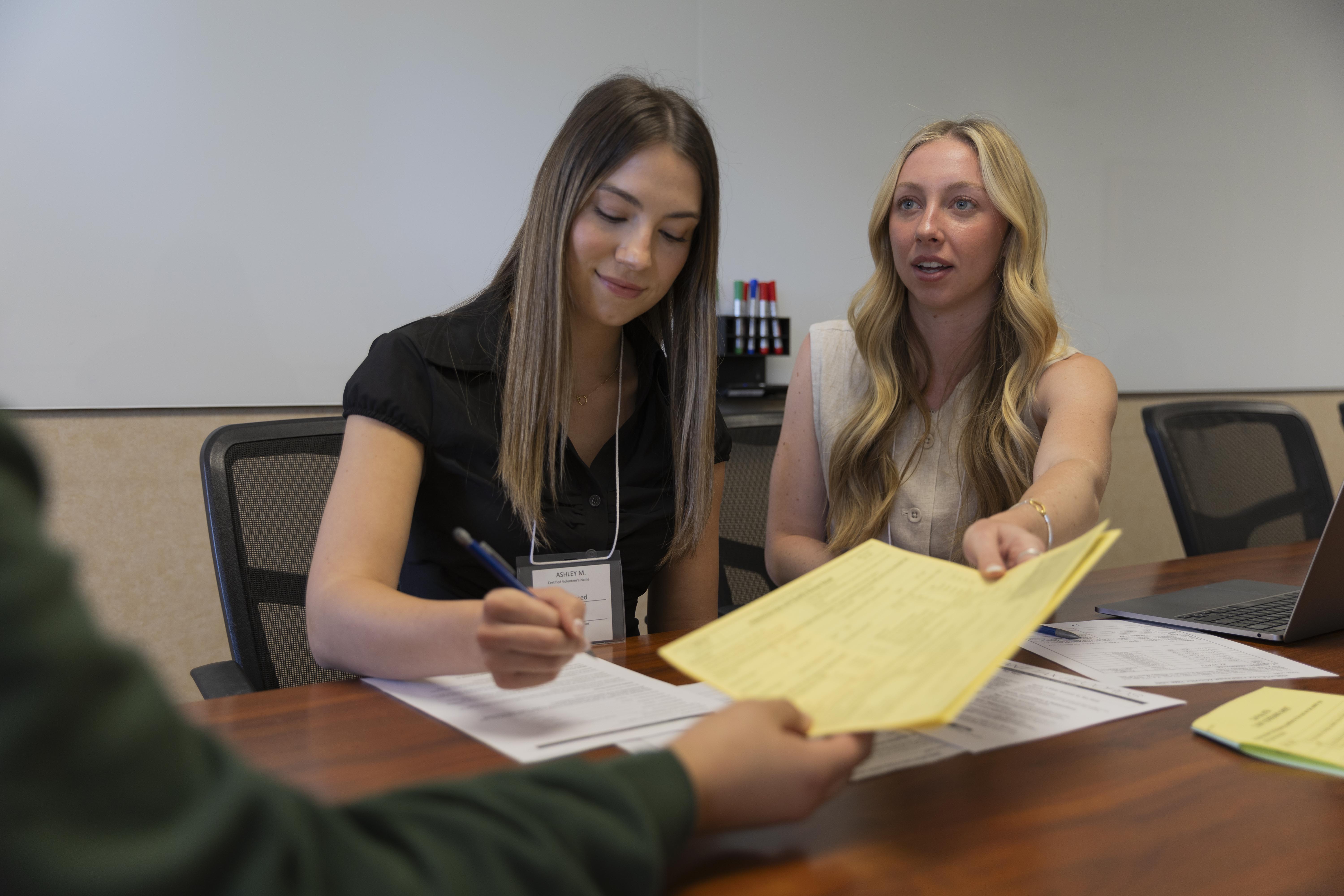 Two students working in the tax clinic