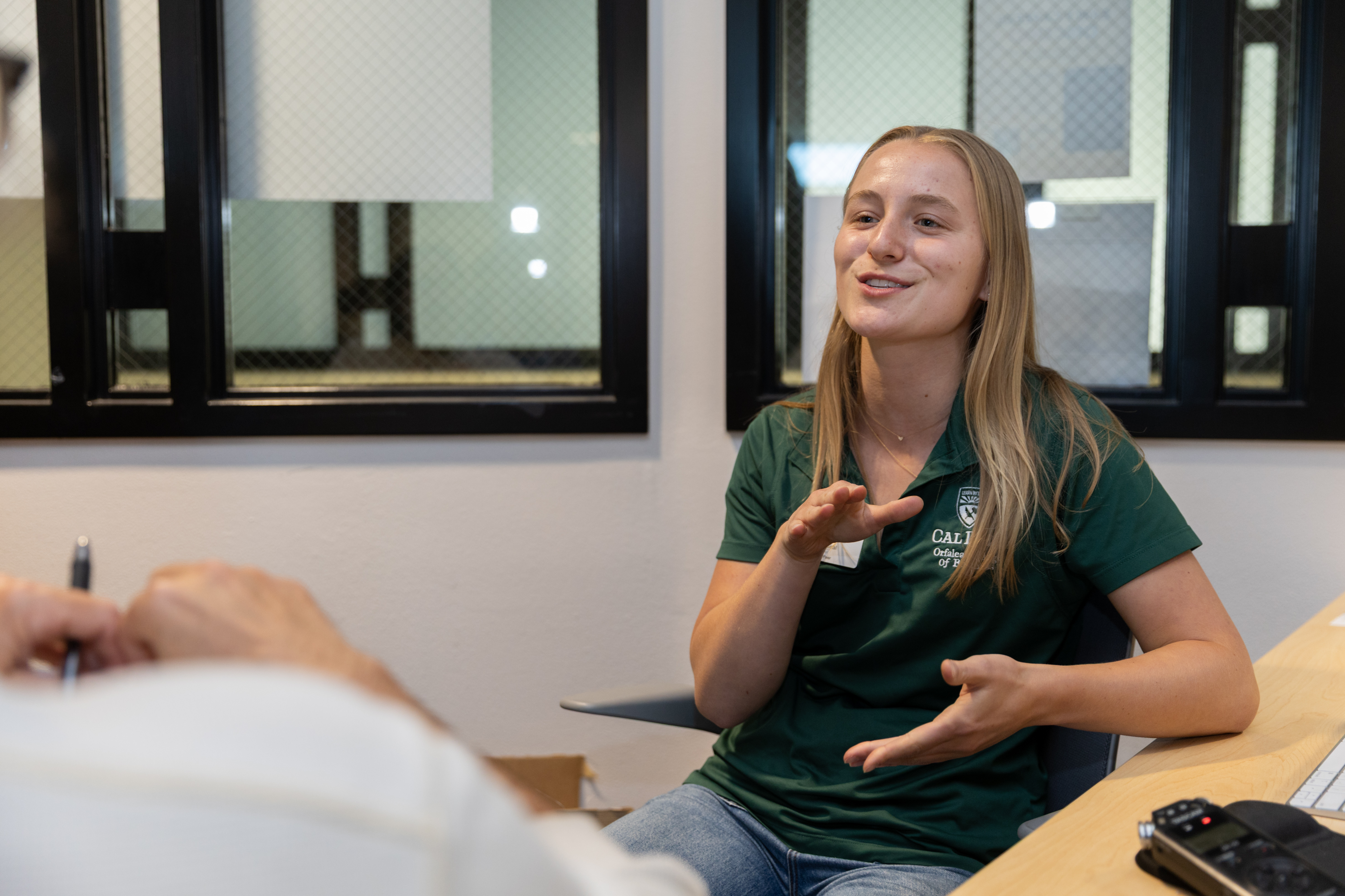 A student peer advisor talks at the Career Readiness Center