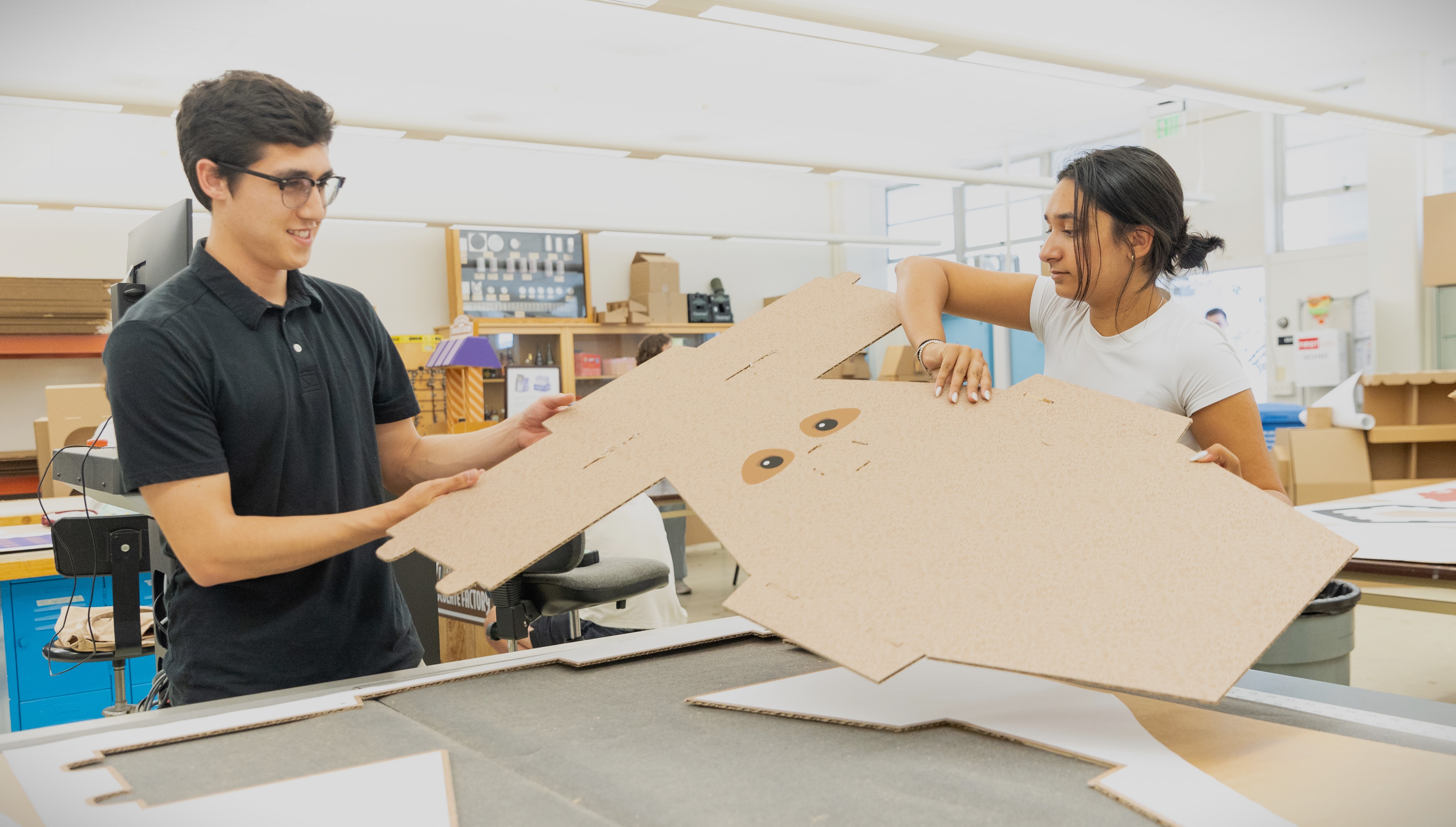 Students in a packaging class work on a project.