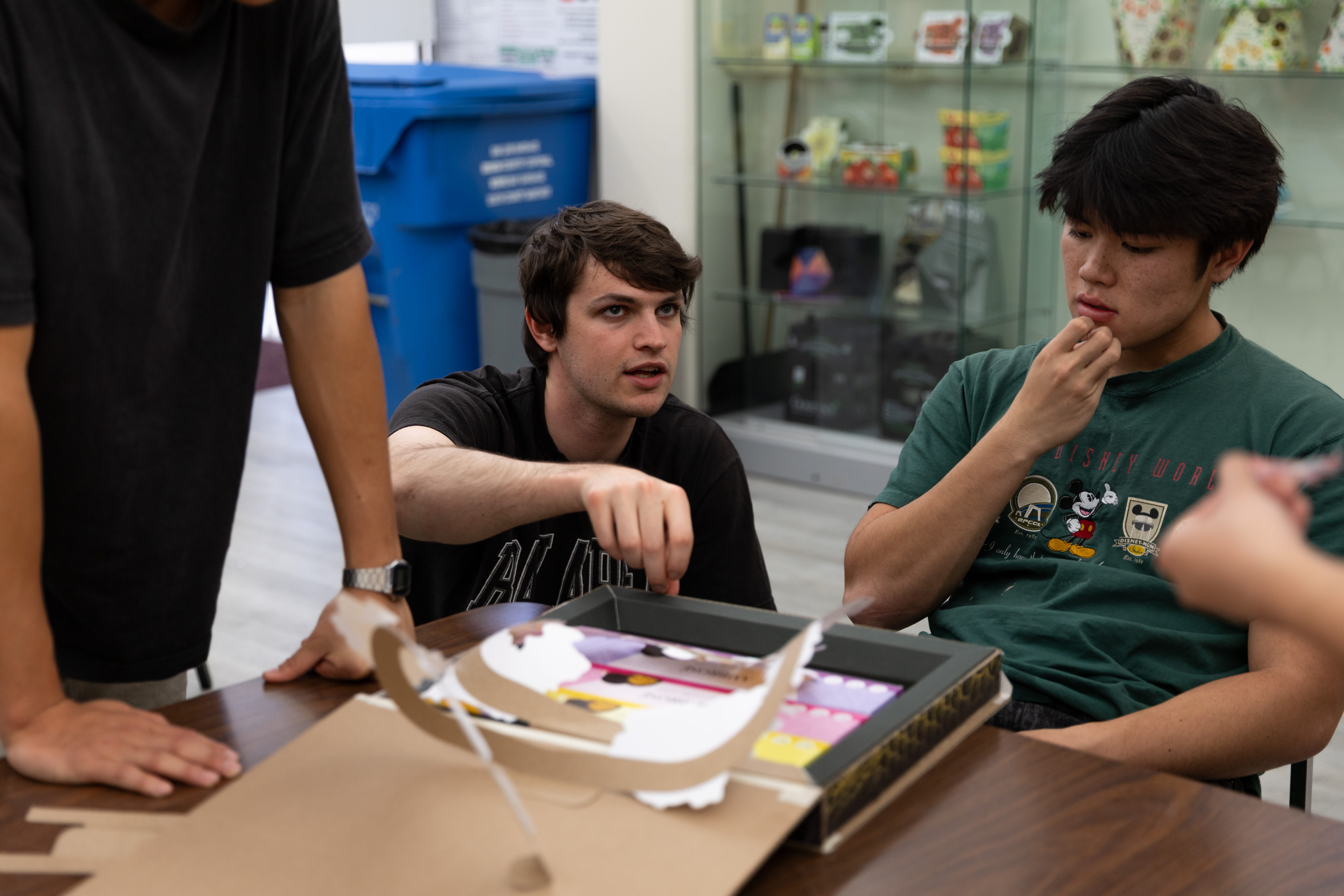 Students collaborate over a packaging project