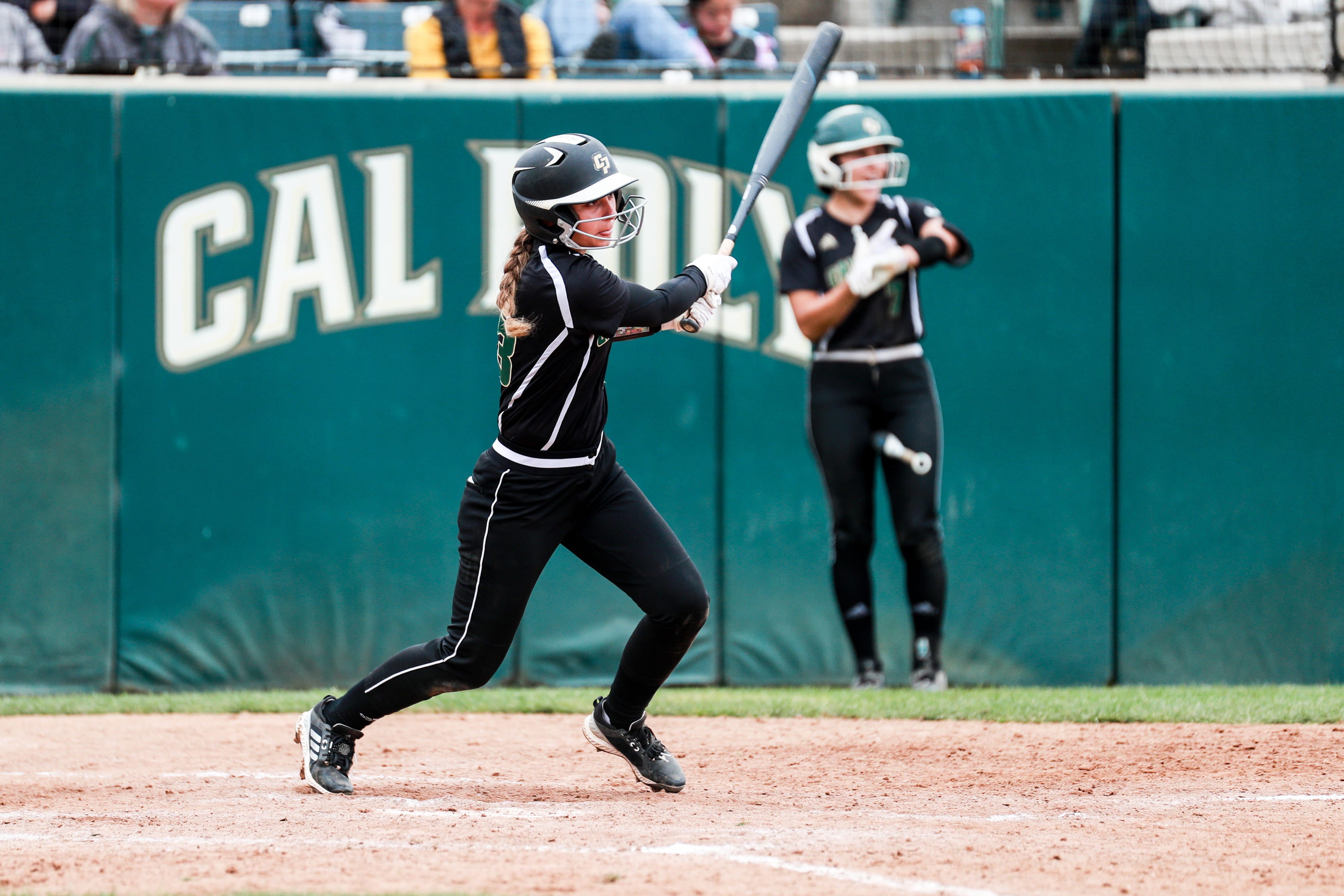 Caroline Allman swings at a pitch during a Cal Poly softball game