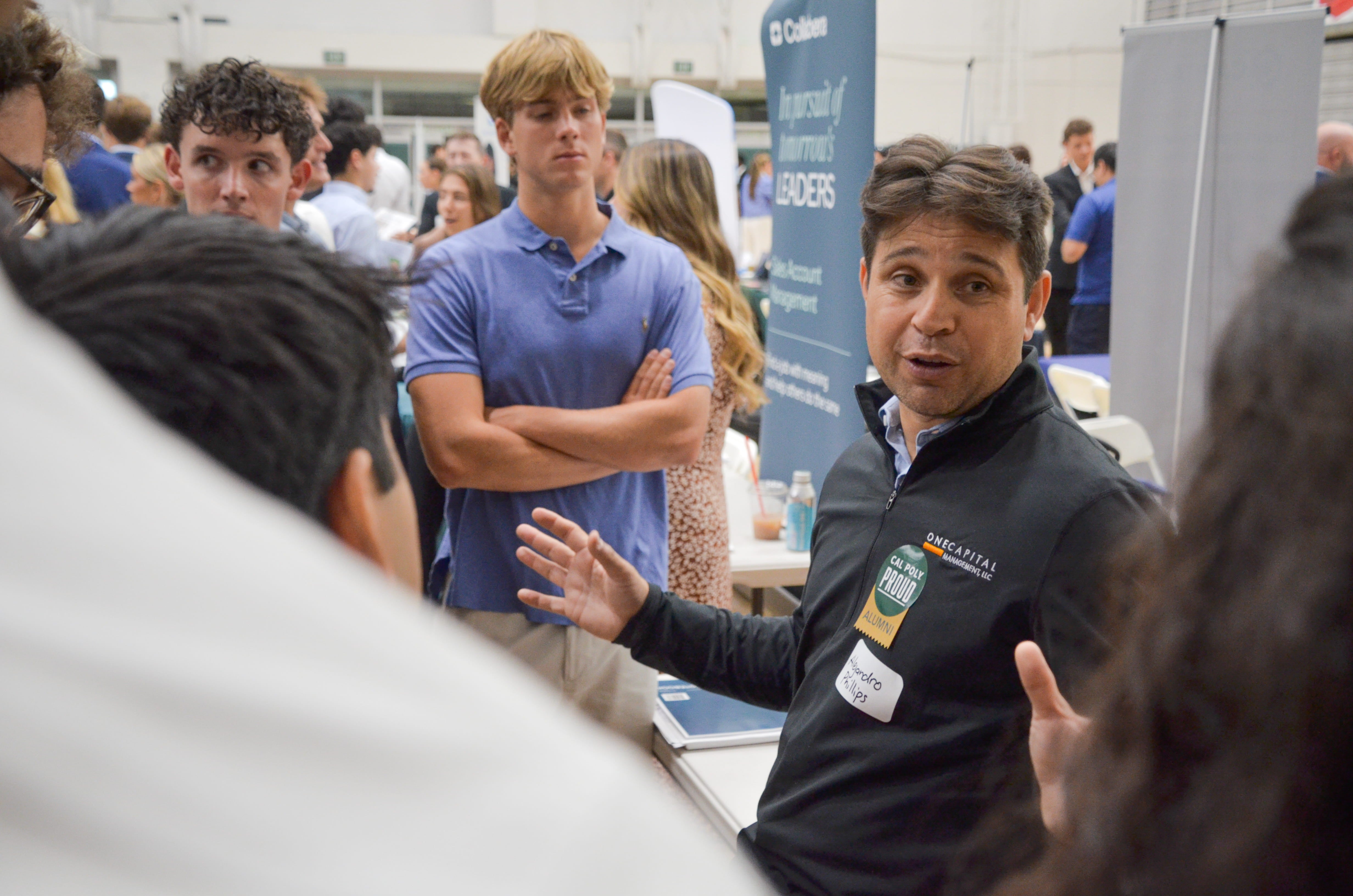 A recruiter talks to students at a Career Fair
