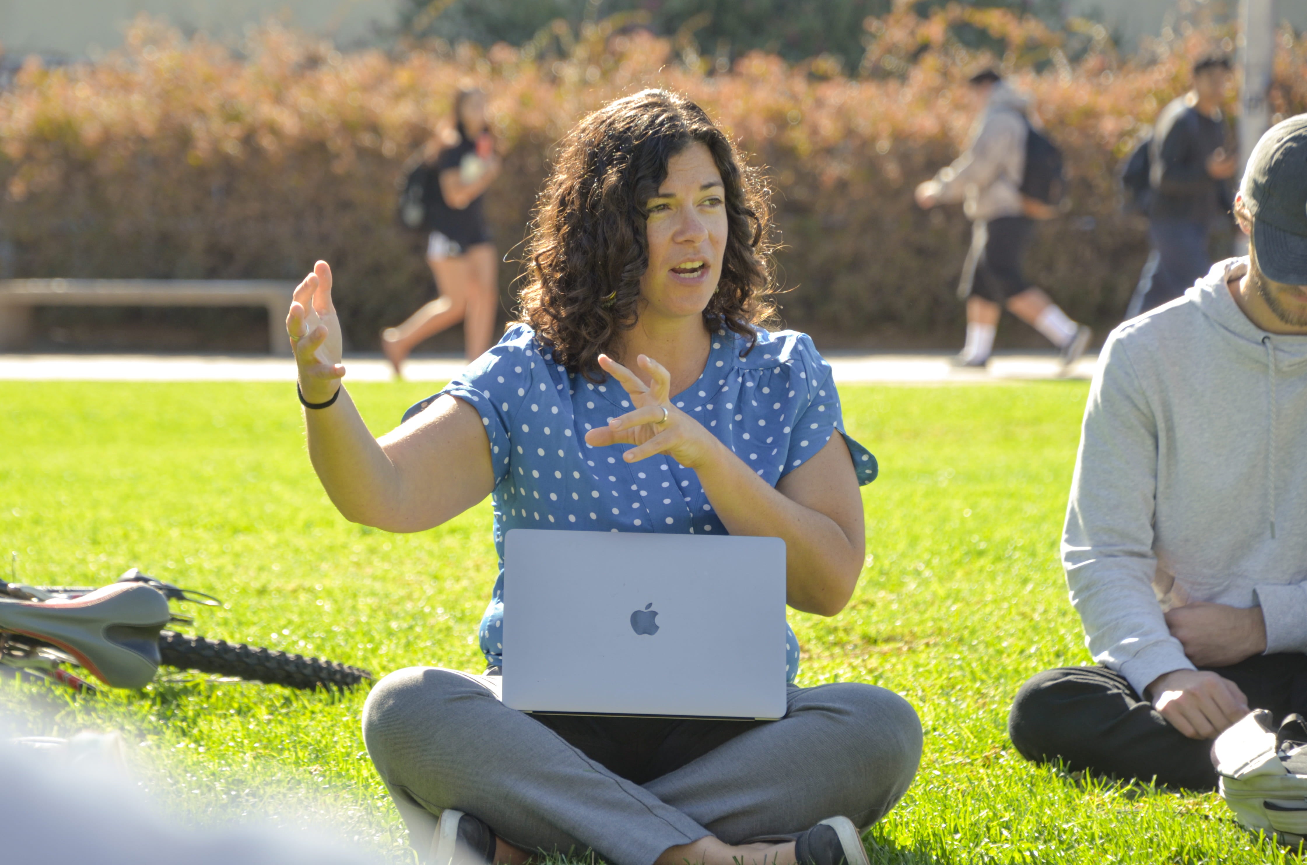 Alexa Loken teaches a class outdoors