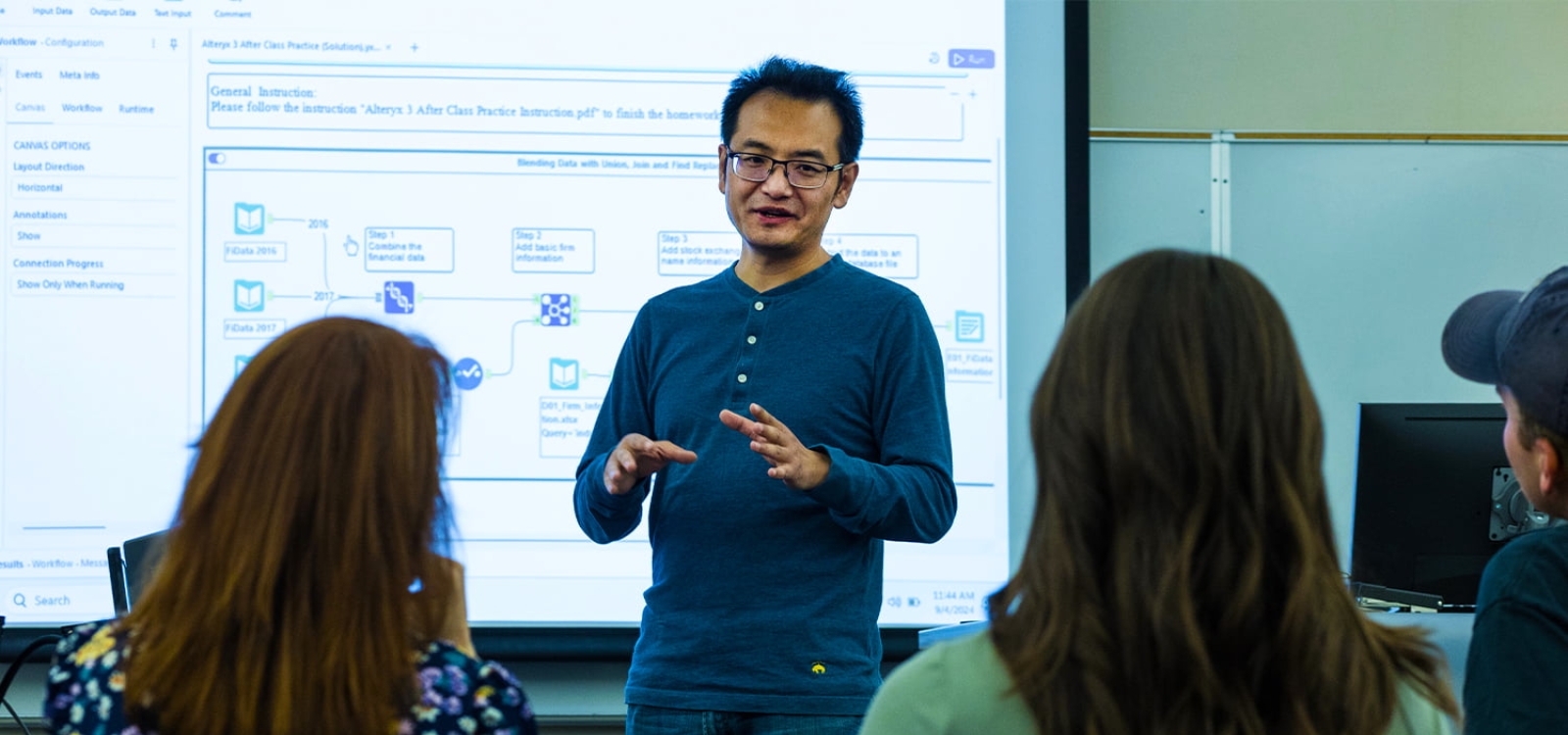 A professor demonstrates software in front of a class