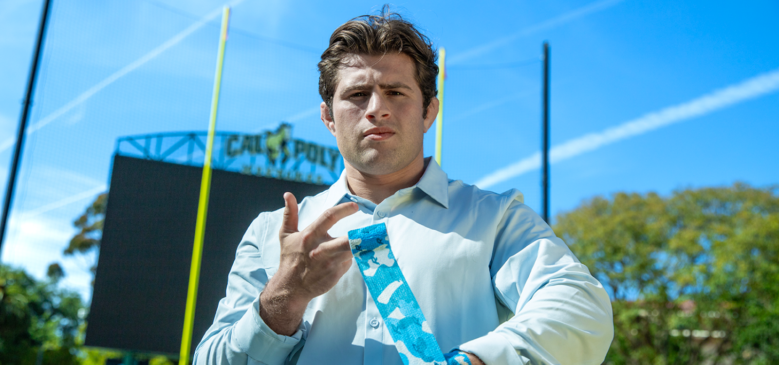 An MBA student demonstrates his athletic tape at the Spanos Stadium