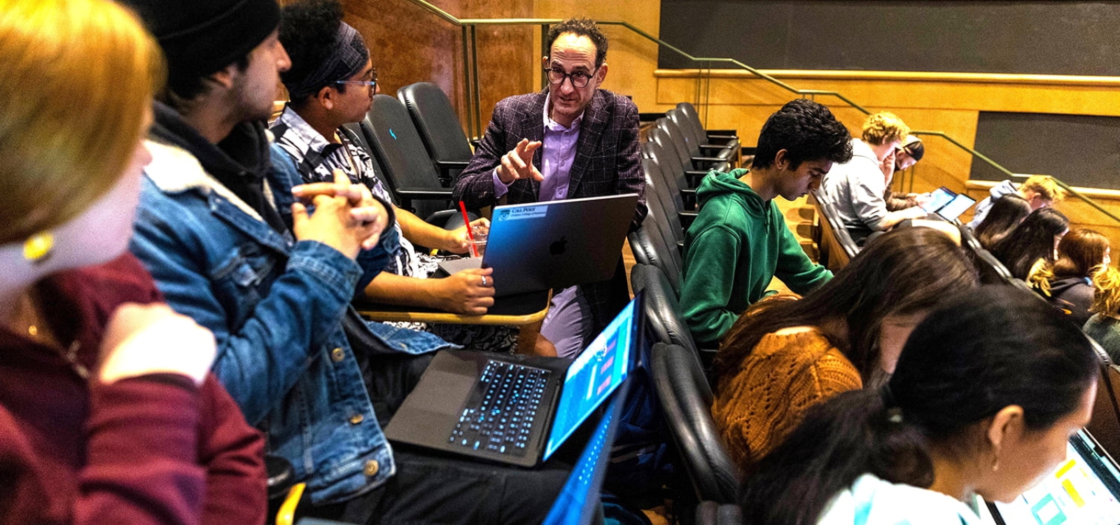 Professor Stern Neill speaks to a group of students in a classroom