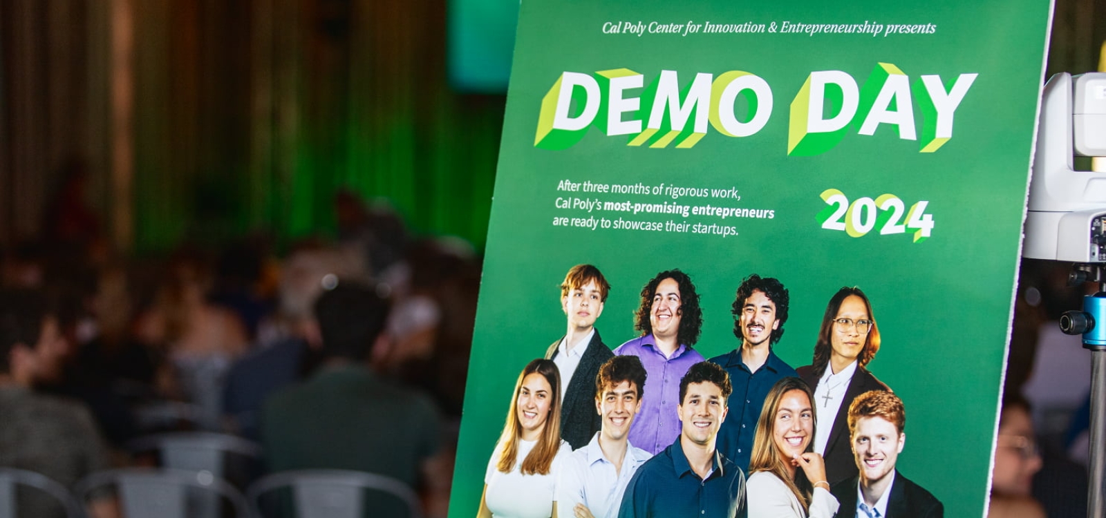 A poster announces Demo Day outside the event