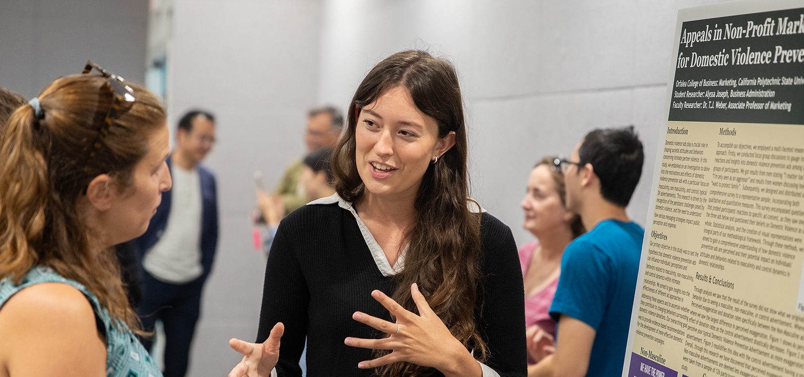 Professor speaking with student at career fair