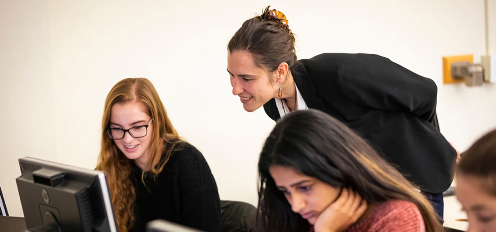Katya Vasilaky, Assistant Professor of Economics, with students