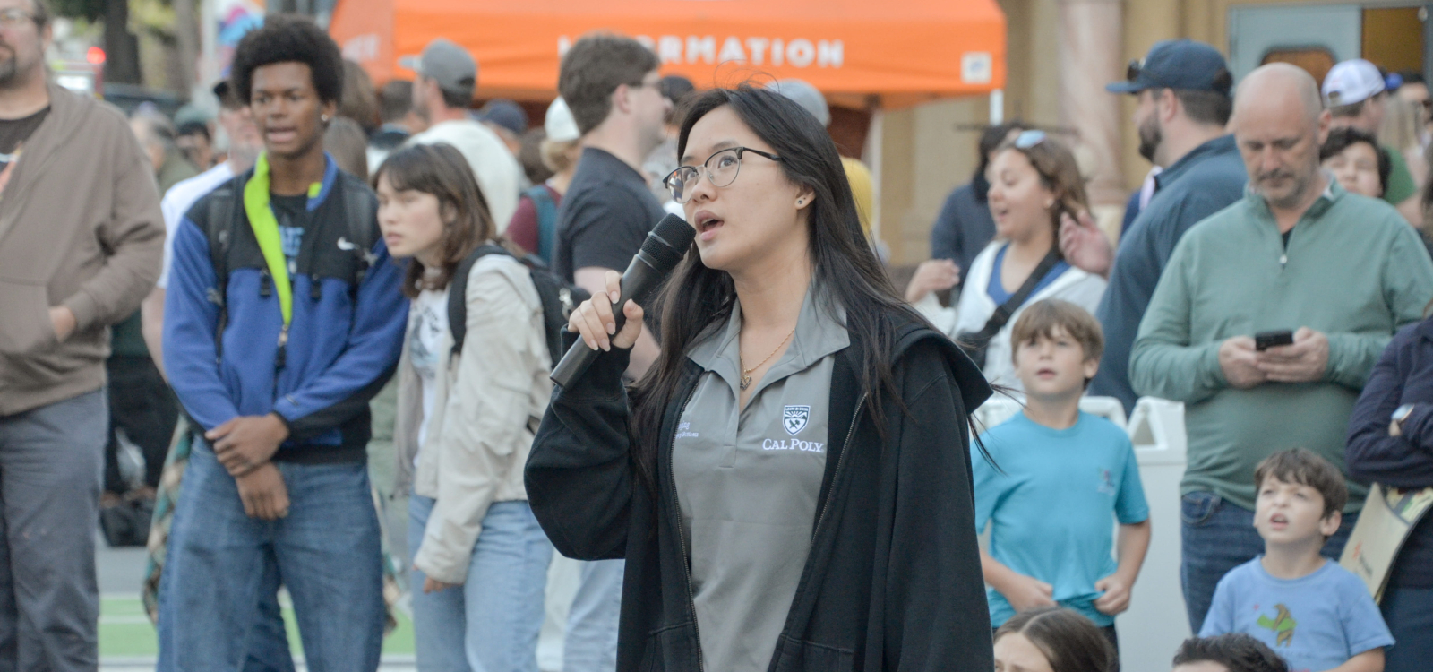 An announcer speaks to the audience during the egg drop competition