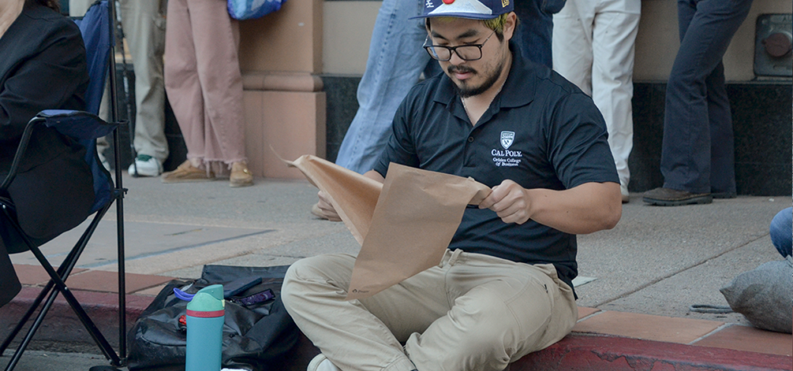 A Cal Poly faculty member prepares an egg package using a provided kit