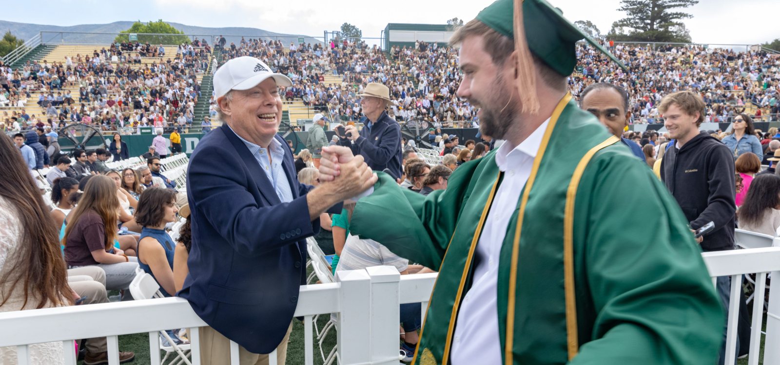 A student gets well wishes at commencement