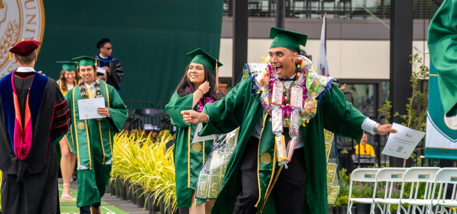 Students happily get their degrees at commnencement