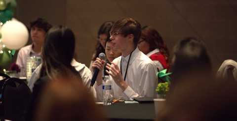 A student poses a question during a keynote speech