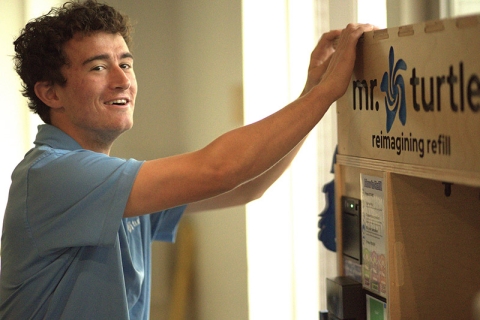 Colin Brown demonstrating Mr. Turtle's product dispenser