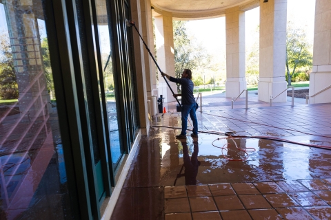 Exterior show of a window washing using an extension