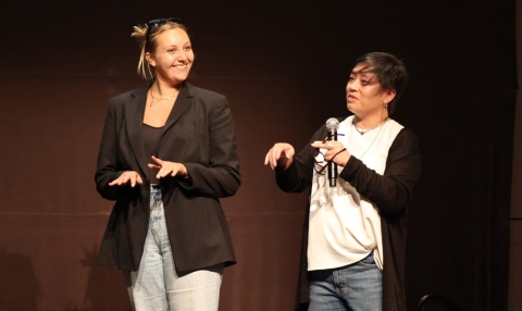 Layna Hathaway appears on stage with Lisa Leong
