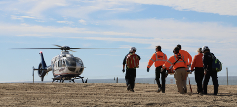Elijah Shanks and the search and rescue team perform a drill with a helicopter