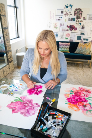 Ceci Johnson, painting watercolors in her studio