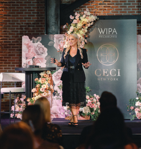 Ceci Johnson speaking at an event for wedding professionals
