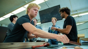 A student works on his team's capstone in the ITP lab