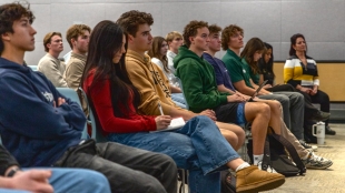 An audience watches a virtual chat with Marc Lore