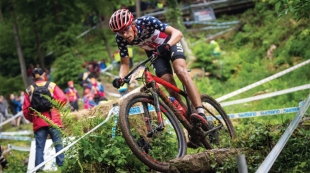 Olympic Cyclist Christopher Blevins cycling down hill