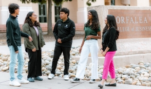 Yeseania Beas and volunteers from the Multicultural Business Program, outside the Orfalea College of Business building.