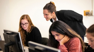 Katya Vasilaky, Assistant Professor of Economics, with students