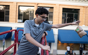 A student drops a packaged egg