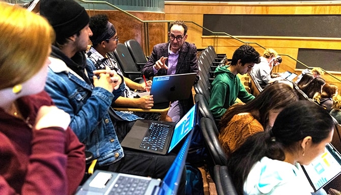 Instructor teaches a group of students