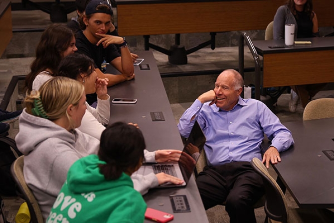 Photo of Paul talking with students