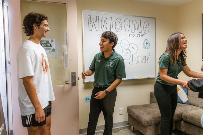MBPC member welcoming a new student to an event.