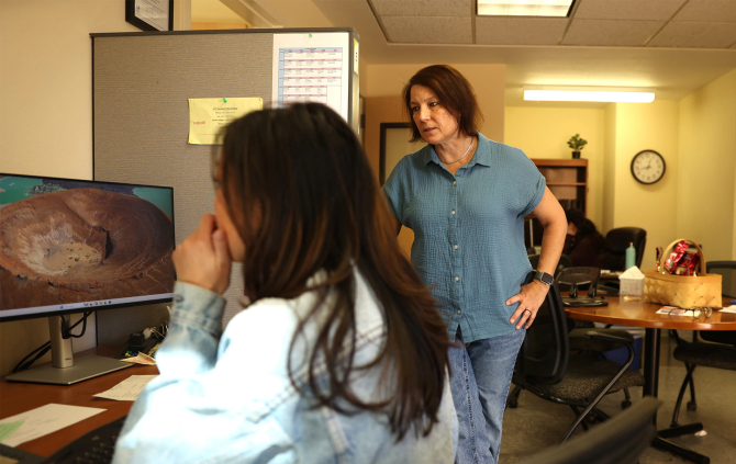 Trisha Daughtrey helps a student worker in the Low Income Taxpayer Clinic