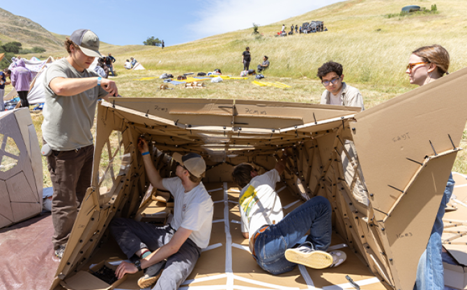 Students work on a shelter project in the Design Village