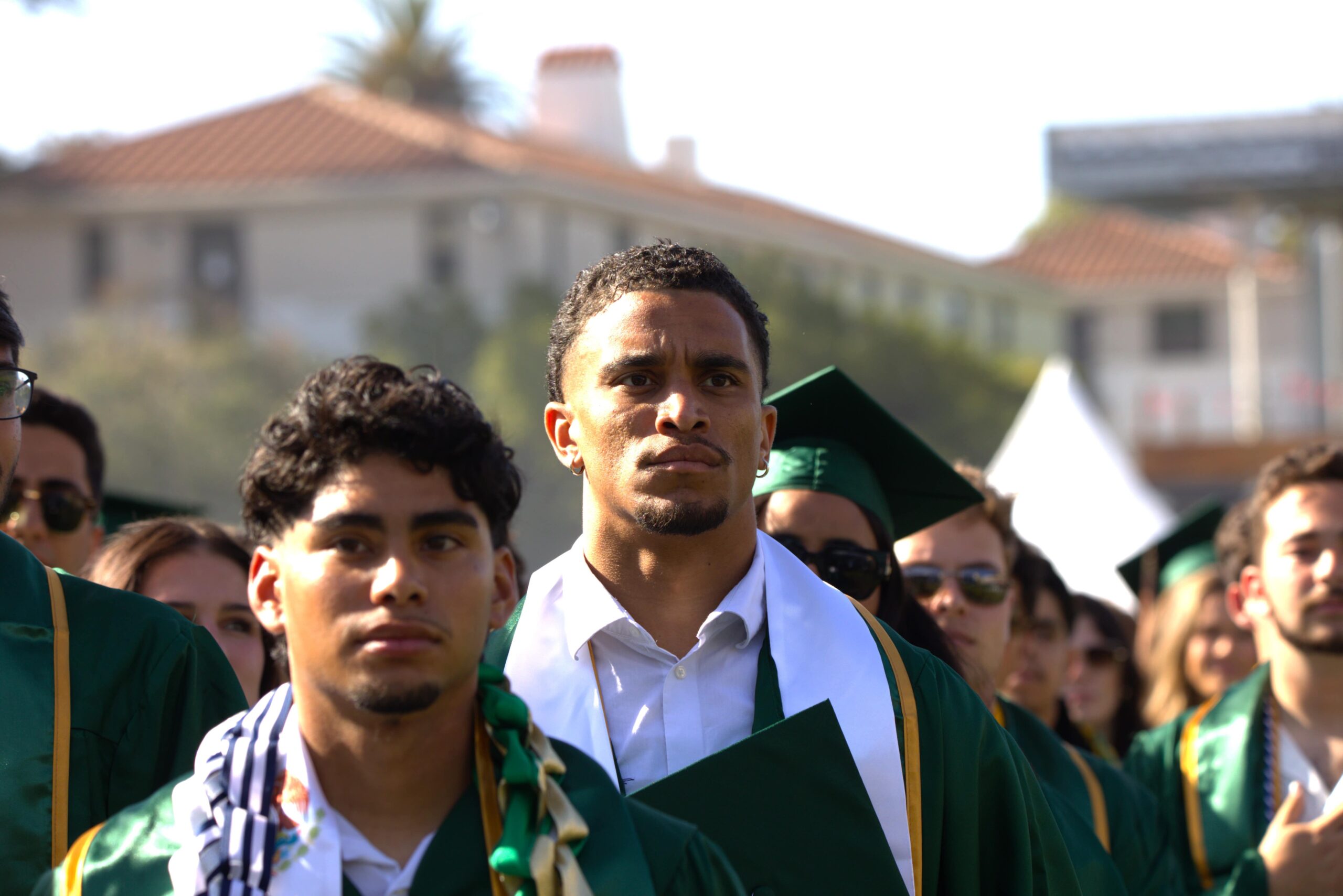 Graduating seniors stand for the pledge of alligiance