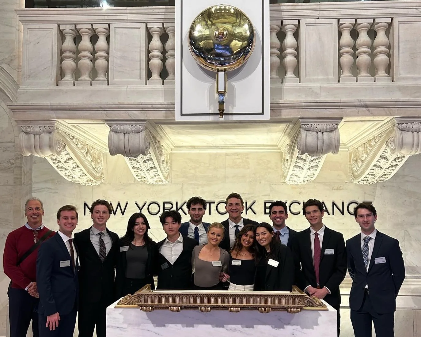 Students and a professor at te New York Stock Exchange