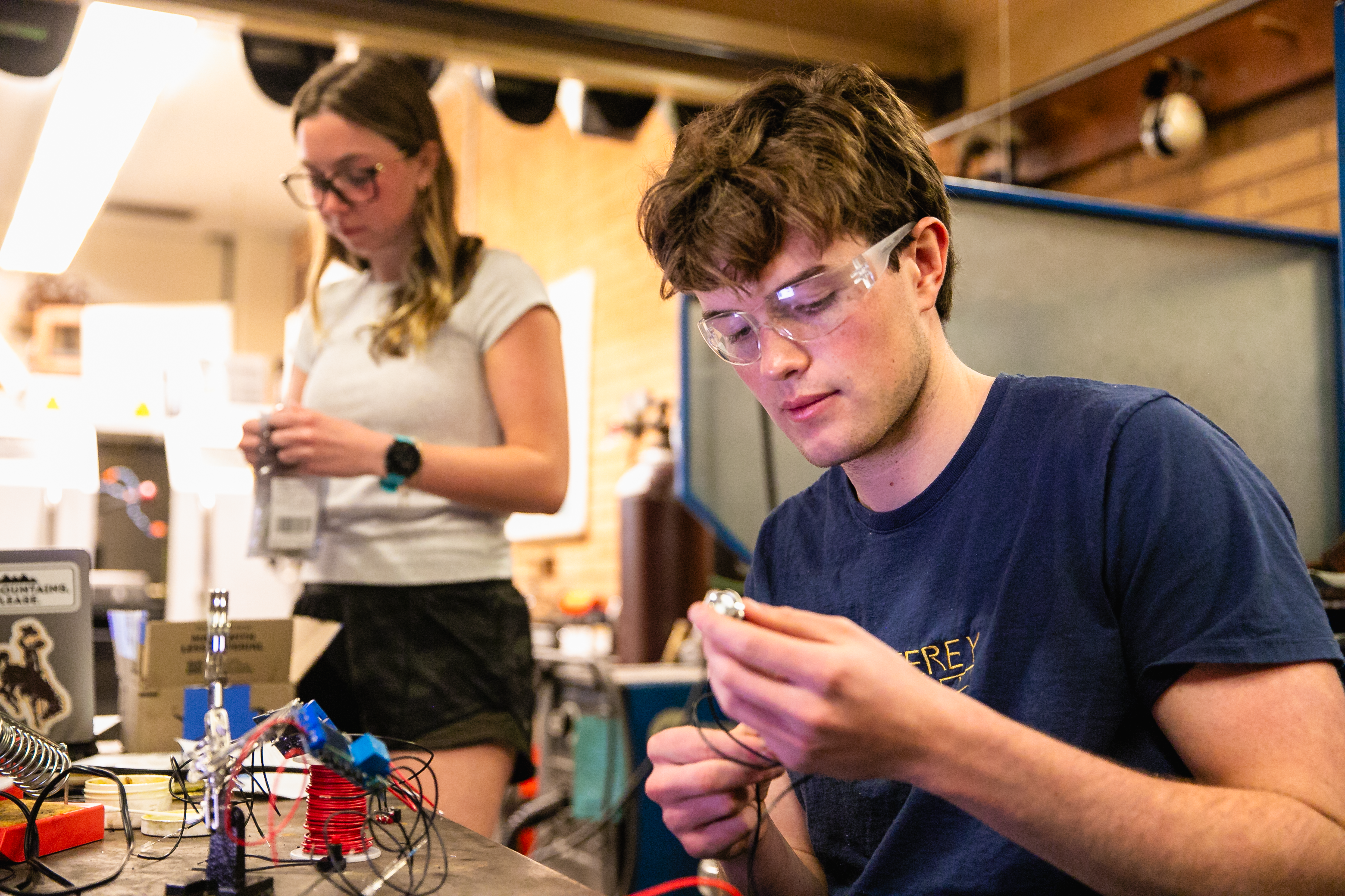 students work in a lab with wires