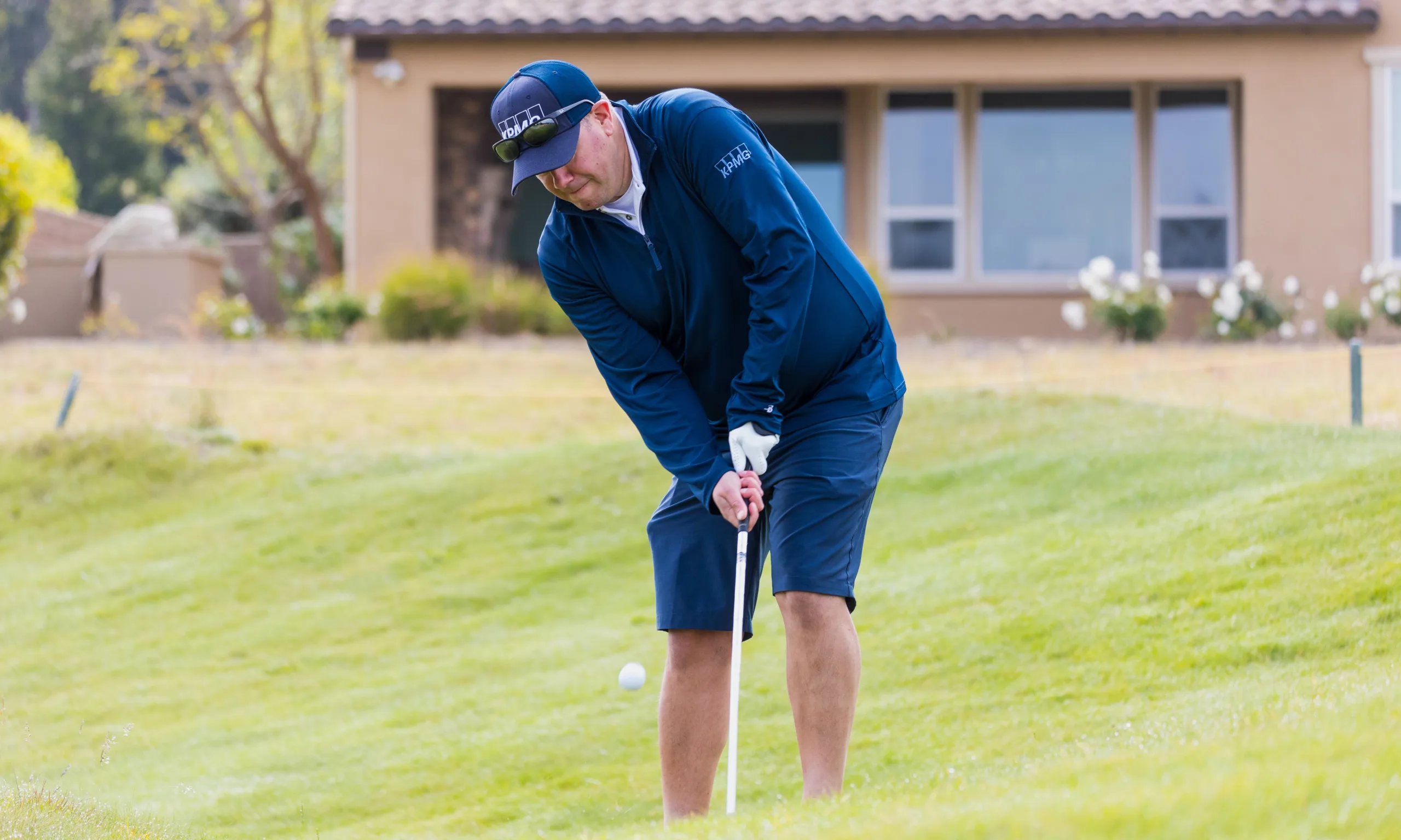 A golfer takes a short iron shot