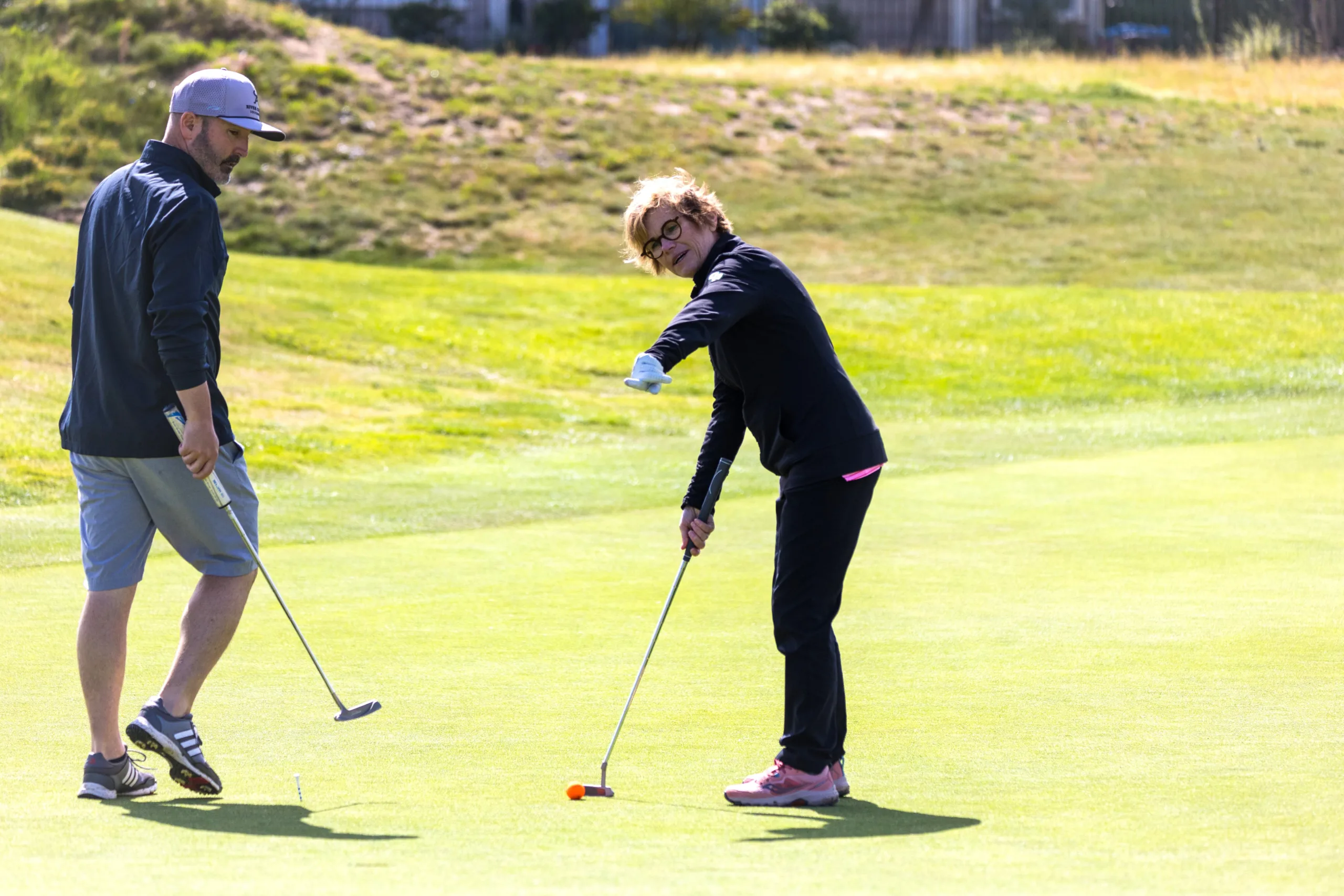 A golfer sizes up a putt